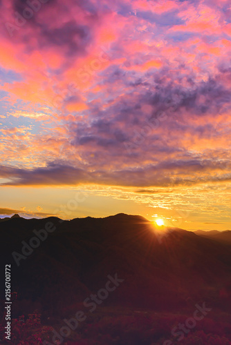 Landscape Series : Stunning golden twilight sunrise view over mountain range in early winter morning at Doi Leng viewpoint Phrae Thailand.