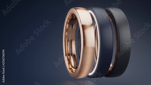 Three Modern Smart Rings Rotating in Studio Lighting