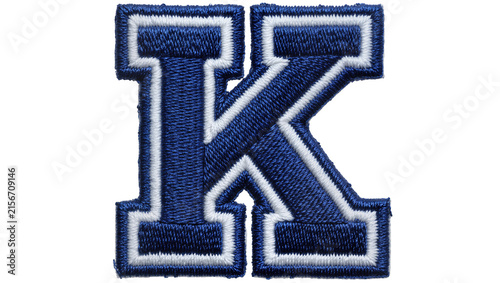 Fotografie Blue and white embroidered letter K patch, isolated on transparent background