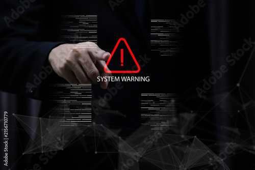 Business professional with system warning alert interface, highlighting cybersecurity, data protection, network security, malware detection, cyber risk, software error, digital technology.