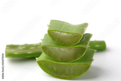Sliced Fresh Aloe Vera Leaves Stacked Isolated on White Background