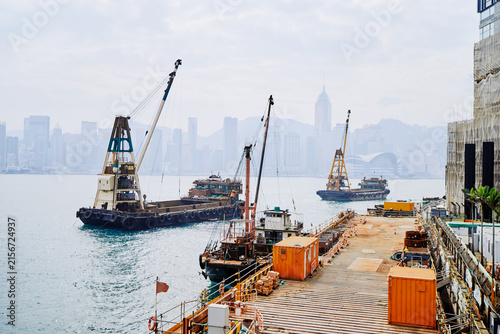Cuadro en lienzo Coastal Construction Dock With Cranes Overlooking the City Skyline on a Foggy Da