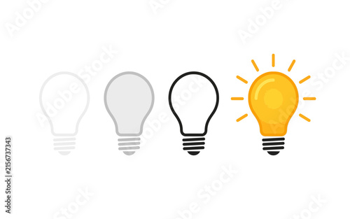 Bild auf Leinwand Four light bulbs in varying stages of illumination from dark to brightly lit
