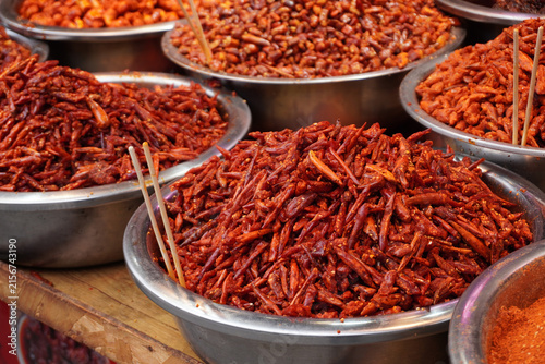A taste of Guizhou. Bold and spicy local chili dishes at the historic Qingyan Ancient Town market, China.