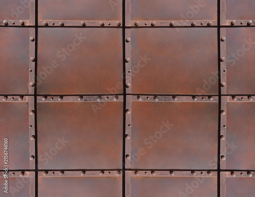 Bild auf Leinwand rusty, weathered rust-eaten metal iron background backdrop panel with rivets