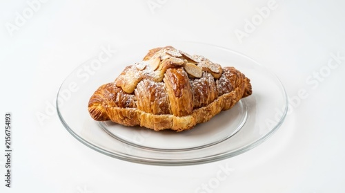 Freshly baked cinnamon swirl bread loaf on glass plate.