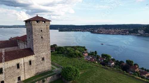Rocca di Angera Historic Fortress Overlooking Lake Maggiore In Angera, Lombardy, Italy. Aerial Pullback Shot