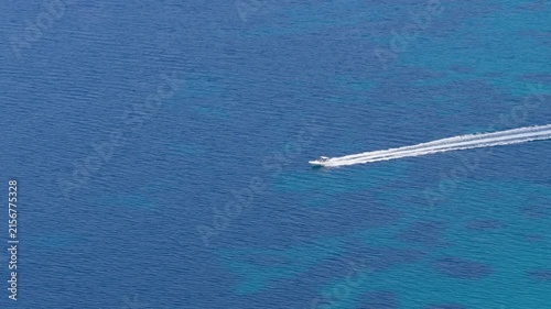 Speedboat crossing deep blue waters