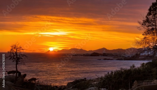 Golden Hour Serenity - A Coastal Sunset Painting the Sky.