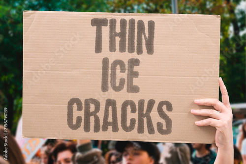 Obraz na plátně "Thin Ice Cracks" A warning written in white, ignored by those who should know better
