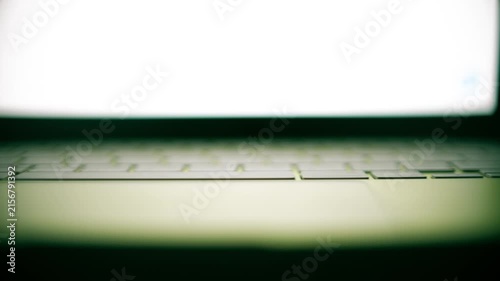 Green Laptop Keyboard With Blank Screen, Shallow Focus Dolly Shot