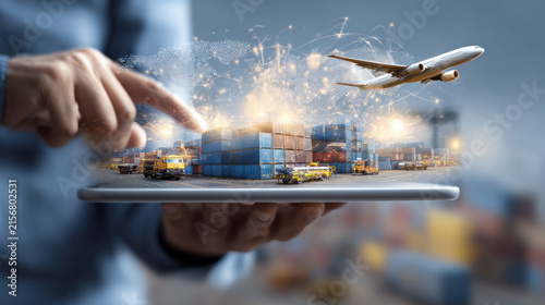 Businessperson Using Tablet with Global Cargo Transport and Worldwide Logistics Concept