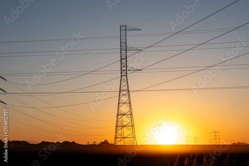 Power Grid Expansion Across Industrial Landscape at Dusk