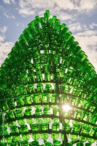 Fragment of the unusual Christmas tree made from the green glass bottles           