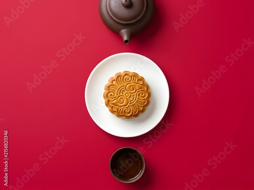 Mid Autumn Festival Mooncake With Teapot And Cup On Red Background