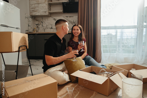 Foto Young couple celebrating moving into new home