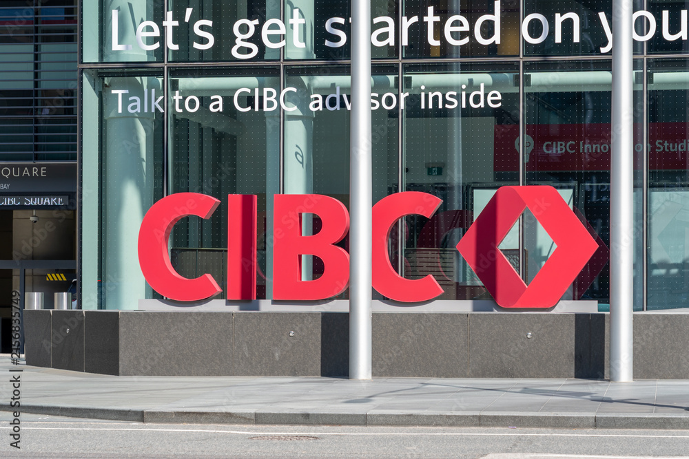 Fototapeta premium Toronto, Ontario, Canada - August 13, 2026: Exterior signage for the Canadian Imperial Bank of Commerce (CIBC) outside the office building at CIBC headquarters on Bay Street in downtown Toronto, Ontar