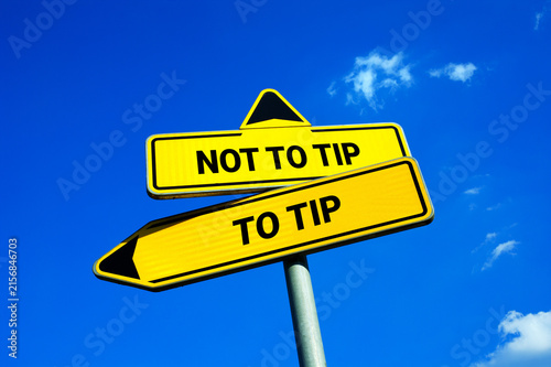 To Tip or Not to Tip - Yellow traffic sign with two options - choosing and deciding during payment for hospitality services. Dining out and gratuity, etiquette and manners in the restaurant or cafe.