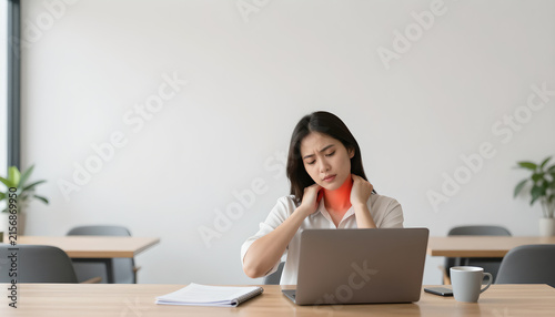 Female Professional Stretching Neck Due to Office Pain: Workplace Wellness