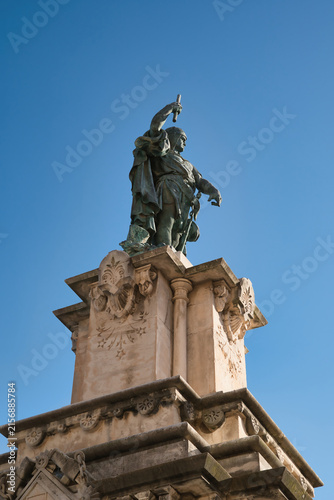 The monument depicted in the image is the statue of Roger de Llúria, the renowned admiral of the Crown of Aragon, located at the end of the Rambla Nova in Tarragona, Spain.