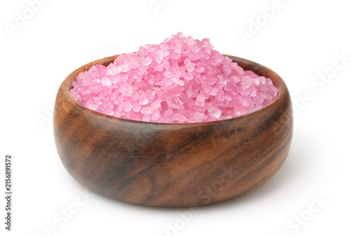 Pink aromatic bath salt in wooden bowl