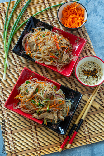 Stir-fried glass noodles with pork and vegetables.