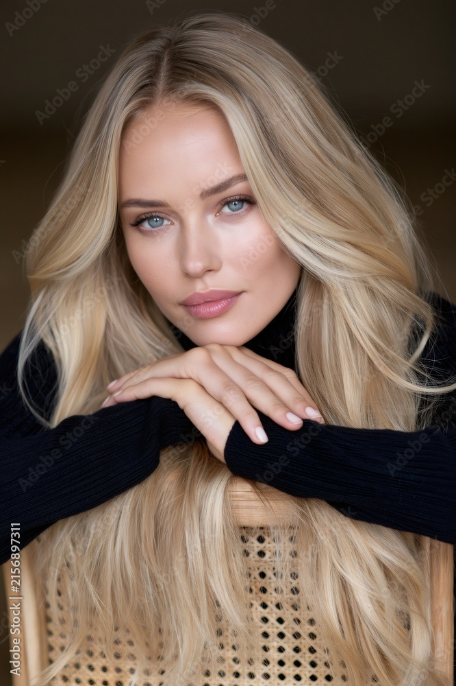 Fototapeta premium Blonde woman posing with long hair, beauty concept