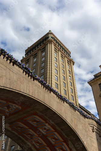 Photography Kungstornen building and decorated arch of Malmskillnadsbron bridge in Stockholm