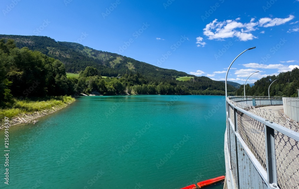 Obraz premium Peaceful Lake With Mountain, Tranquil Alpine Landscape With Shimmering Waters And Slopes
