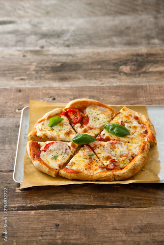 Homemade pizza with tomatoes and mozzarella cheese
