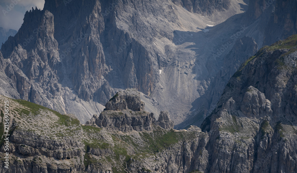 Obraz premium Mountain landscape panorama Tre Cime Mount against a blue summer background.