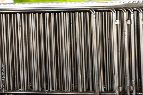 Obraz na płótnie Metal pipe rack with organized stainless steel tubes in industrial storage area