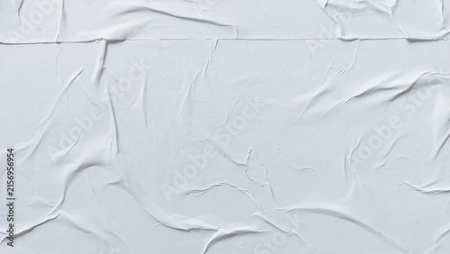 Fotografie White crumpled paper poster with soft creased surface texture