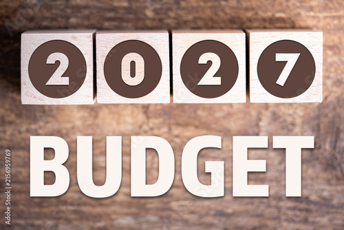 Budget 2027 new year on wooden blocks and office business concept background. 2027 Budget planning and allocation concept concept. 2027 New year resolutions, goals