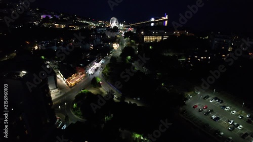 High Angle Night Footage of Illuminated Buildings and Roads with Traffic at Best Tourist Attraction Destination of England at Bournemouth City with Sandy Beach and Ocean of Great Britain, 