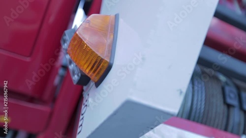 Cinematic shot of a flashing hazard light on a fire engine with shallow depth of field