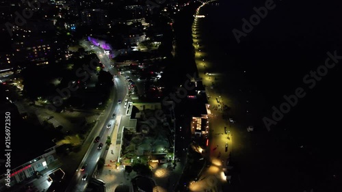 High Angle Night Footage of Illuminated Buildings and Roads with Traffic at Best Tourist Attraction Destination of England at Bournemouth City with Sandy Beach and Ocean of Great Britain, 