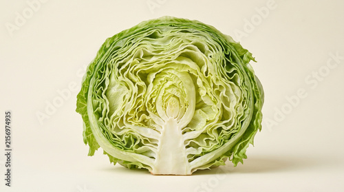 Fresh Iceberg Lettuce Head Cut in Half Showing Crisp Inner Cross Section on Neutral Background