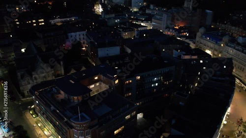 High Angle Night Footage of Illuminated Buildings and Roads with Traffic at Best Tourist Attraction Destination of England at Bournemouth City with Sandy Beach and Ocean of Great Britain, 