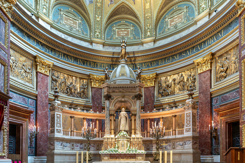 Konstfotografi Wide view of the sanctuary apse with bronze reliefs and the main altar statue of