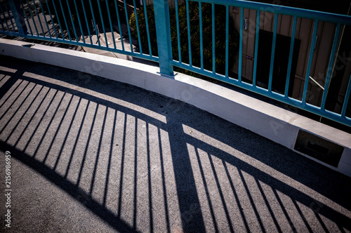 Turquoise Blue  Bridge Railing with a Silhouette.