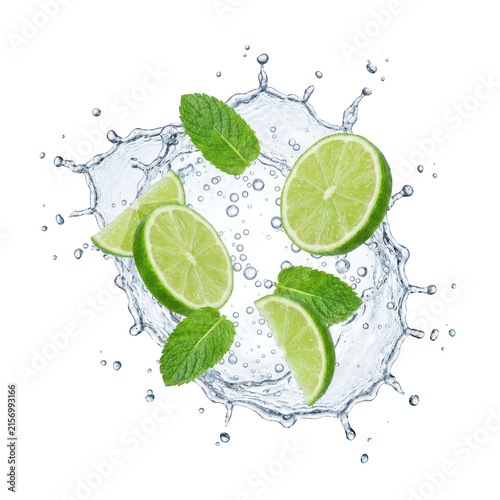 Fresh lime slices and mint leaves floating in water splash isolated