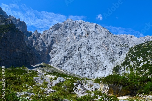 EMountain landscape with rocks and bushes bellow steep rock cliff of Prisojnik mountain in Julian alps, Gorenjska, Slovenia