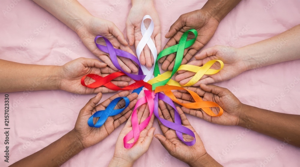 Fototapeta premium Diverse hands holding colorful awareness ribbons in a circle
