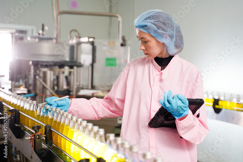 Quality control inspection of liquid food products on an industrial manufacturing line.	