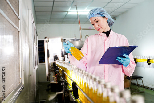 Quality control inspection of liquid food products on an industrial manufacturing line.	