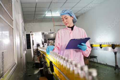 Quality control inspection of liquid food products on an industrial manufacturing line.	