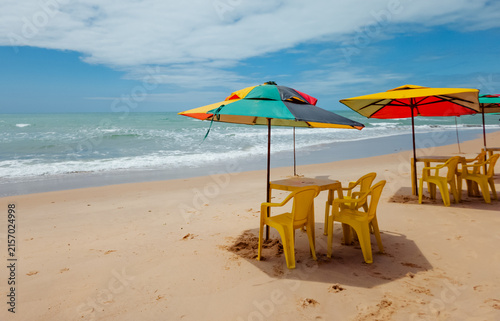 Relaxing Beach Scene with Umbrellas and Turquoise Sea, Brazil