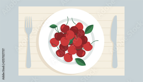 Fresh sweet red cherries on a round white plate with a silver fork and knife on a light colored wooden table surface.