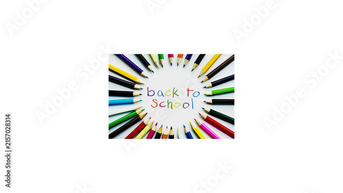 Foto Circle of colored pencils around back to school text on white background